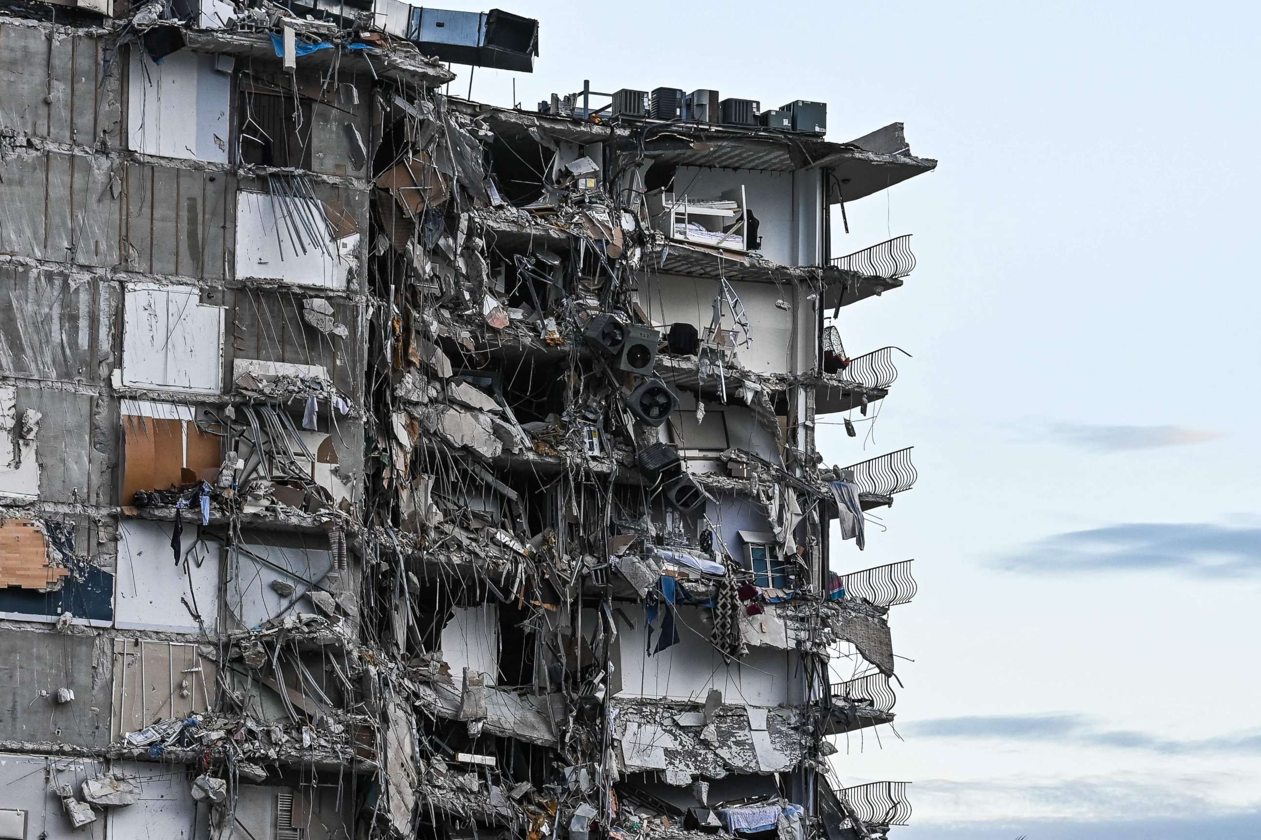 PHOTO: Rubble hangs from a partially collapsed building in Surfside, Fla., north of Miami Beach, on June 24, 2021.