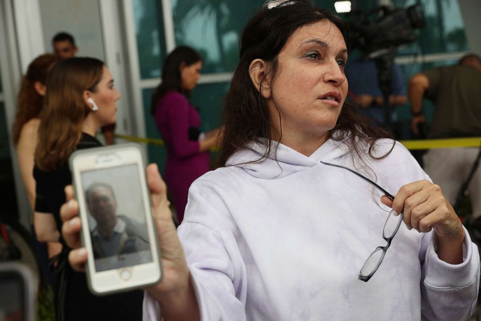 PHOTO: Soriya Cohen shows a picture of her husband, Brad Cohen, who she said is missing after the partial collapse of the 12-story condo tower that he was in on June 24, 2021, in Surfside, Fla.