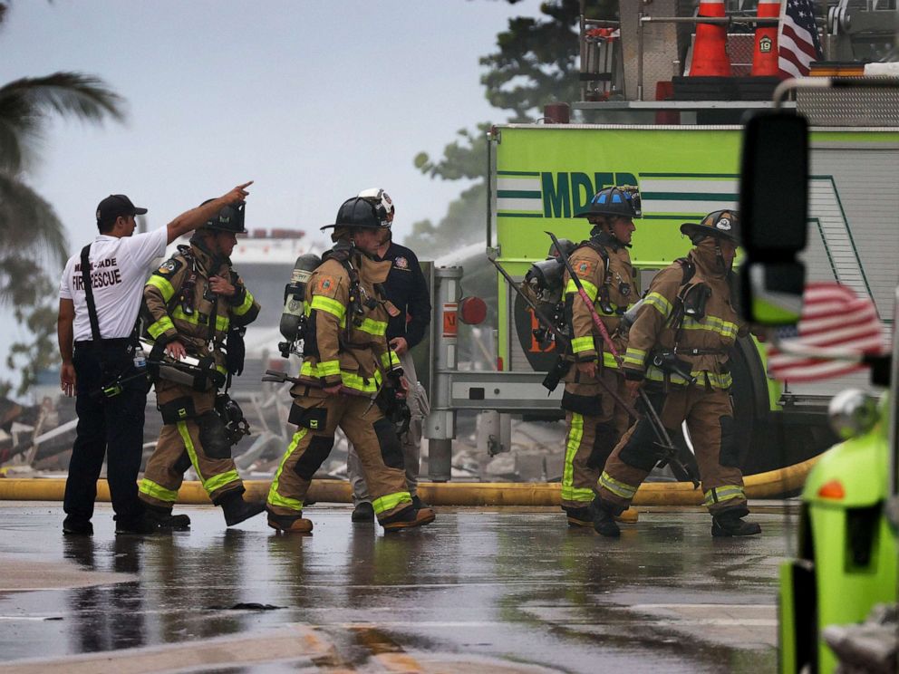 PHOTO: Miami-Dade Fire Rescue personnel continue search and rescue operations in the partially collapsed 12-story Champlain Towers South condo building on June 24, 2021, in Surfside, Fla.