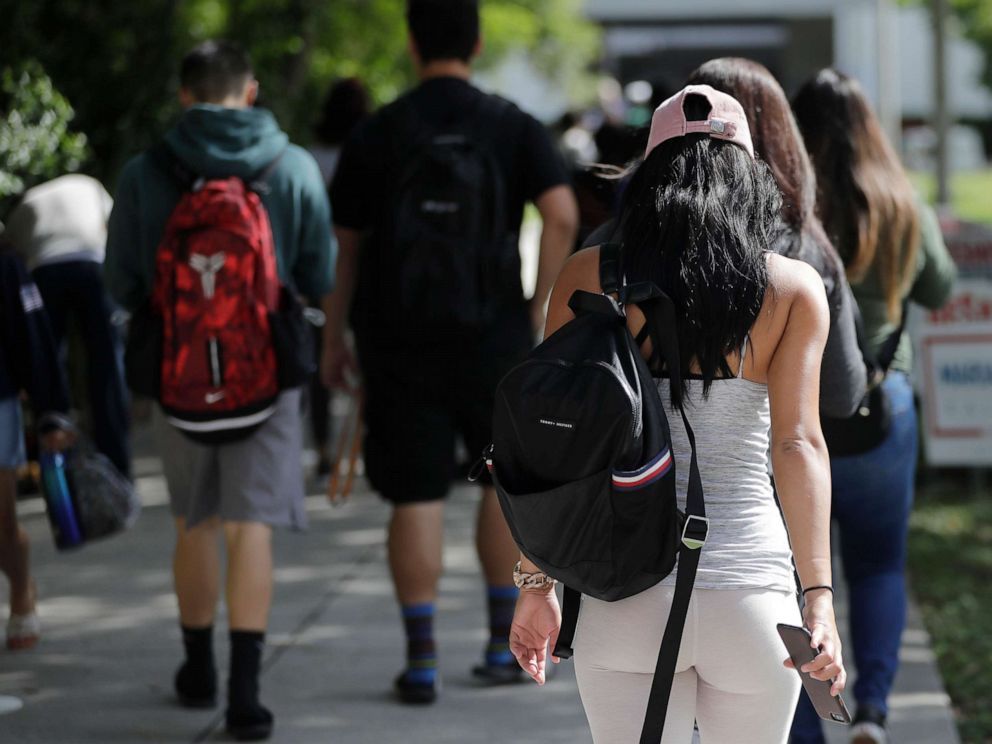 PHOTO: Students walk on the campus of Miami Dade College in Miami, Oct. 23, 2018.