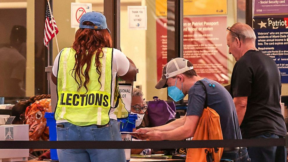 PHOTO: Miami-Dade residents cast their ballots during the first day of early voting in Miami-Dade County at the Miami-County Hall in downtown Miami, on Oct. 24, 2022.