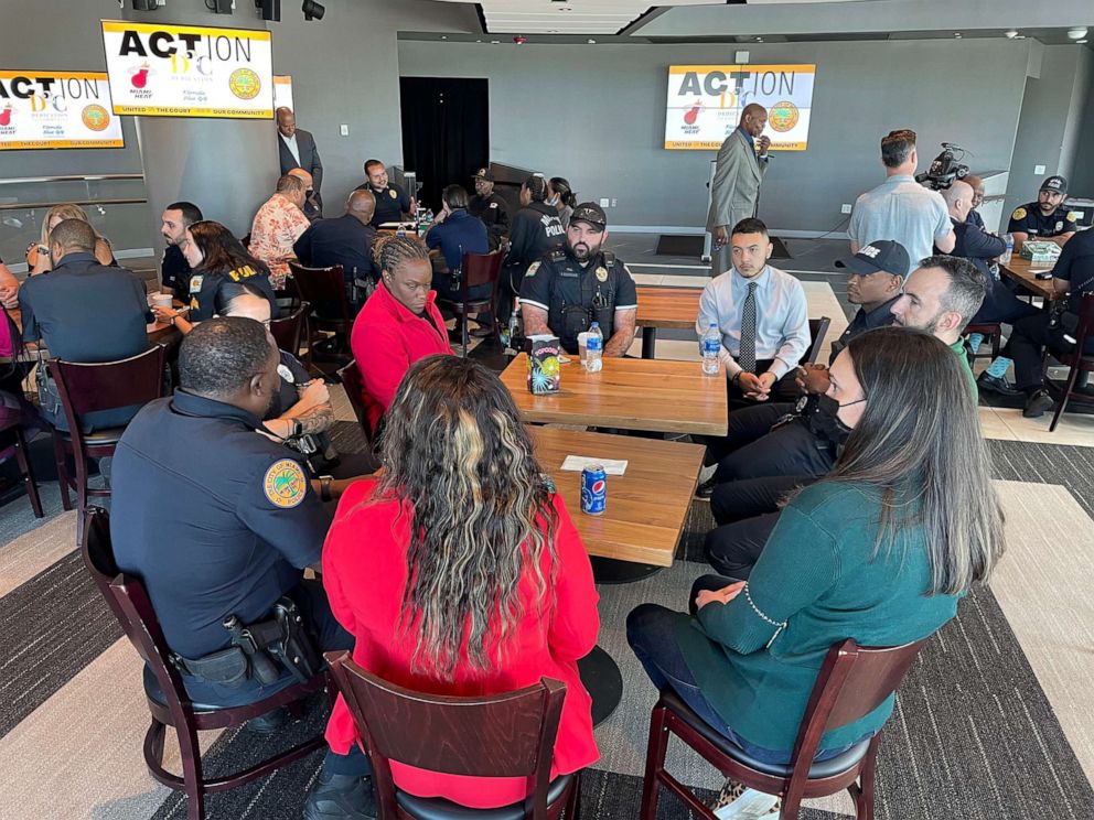 PHOTO: Community participants and officers engage in discussion during training.