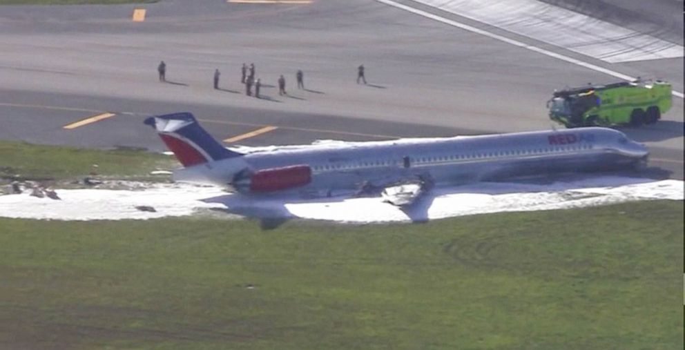 PHOTO: Miami-Dade Fire Department respond to the scene of an airplane skidding off the runway during landing and fire at Miami International Airport, June 21,, 2022.