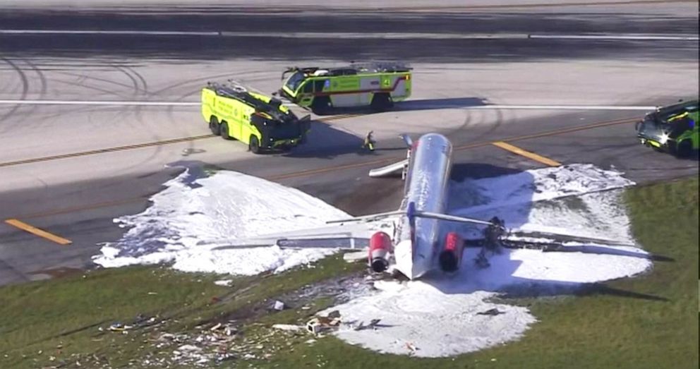 PHOTO: Miami-Dade Fire Department respond to the scene of an airplane skidding off the runway during landing and fire at Miami International Airport, June 21,, 2022.