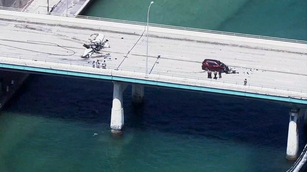 PHOTO: A small plane crash-landed onto a Miami bridge Saturday, May 14, 2022, striking a vehicle, officials said.