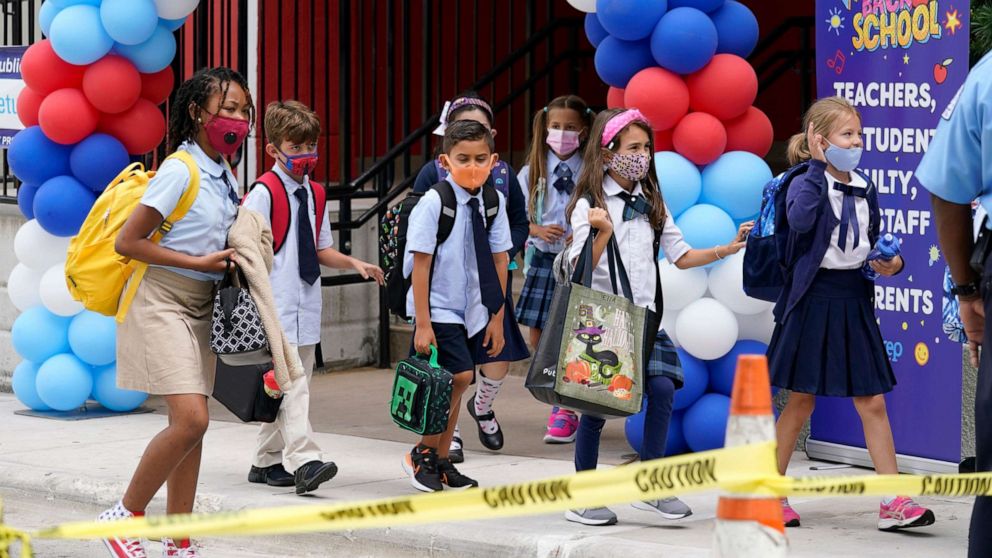 PHOTO: Students walk out of iPrep Academy on the first day of school, Aug. 23, 2021, in Miami.