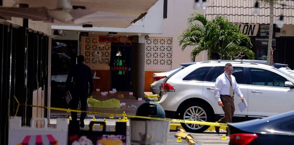 PHOTO: Bodies lay covered with yellow tarps in front of El Mula Banquet Hall in northwest Miami-Dade County, near Hialeah, Fla., May 30, 2021.