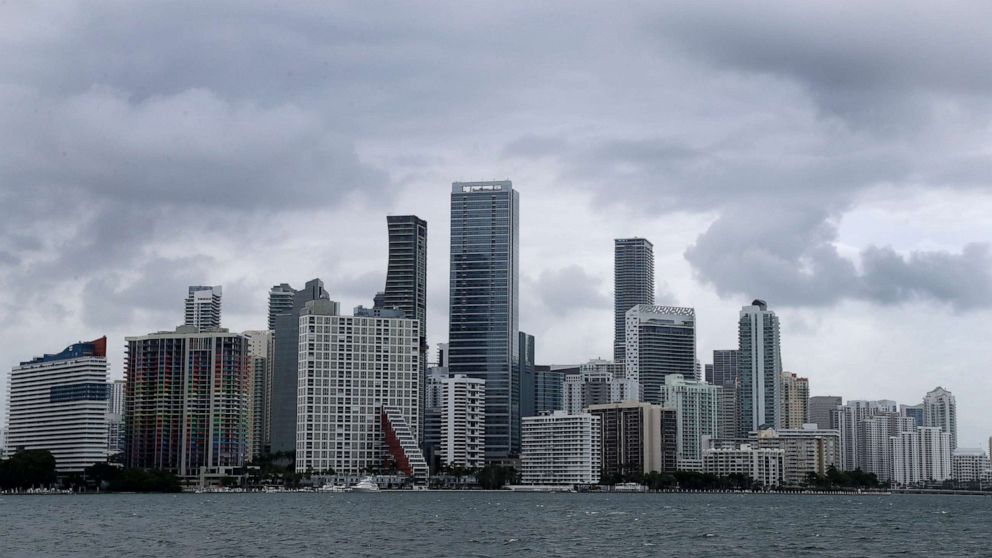 PHOTO: Clouds loom over the Miami skyline, May 14, 2020. 