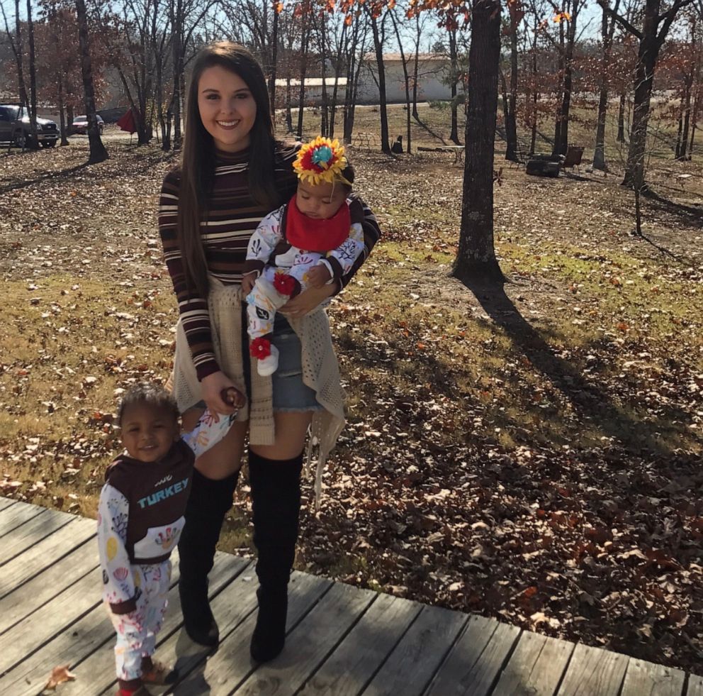 PHOTO: Micah with toddlers Korgen and Haizlee.