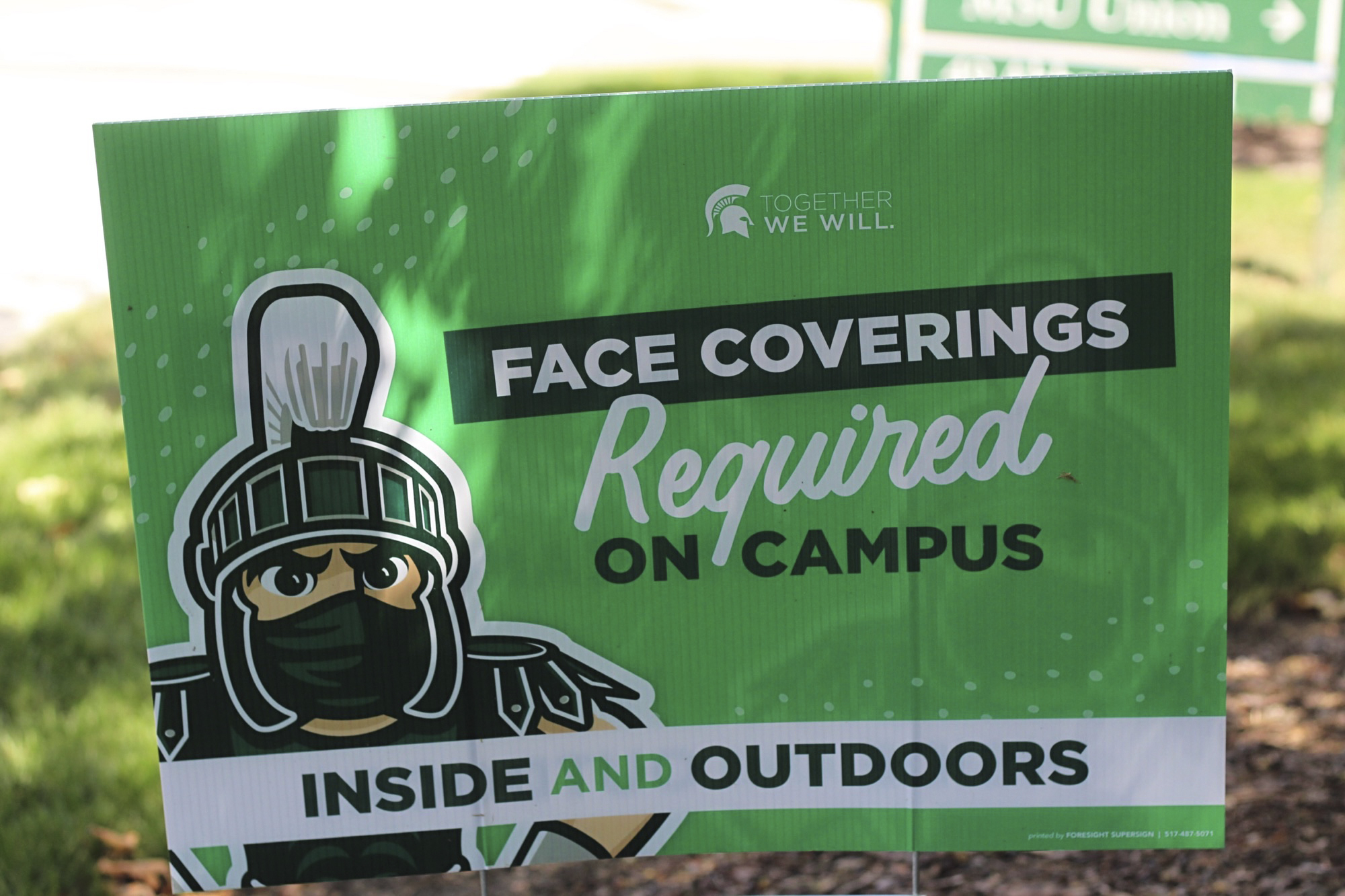 PHOTO: A sign outside the Michigan State University Student Union building alerts students to MSU's face covering rule on Friday, Aug. 21, 2020.