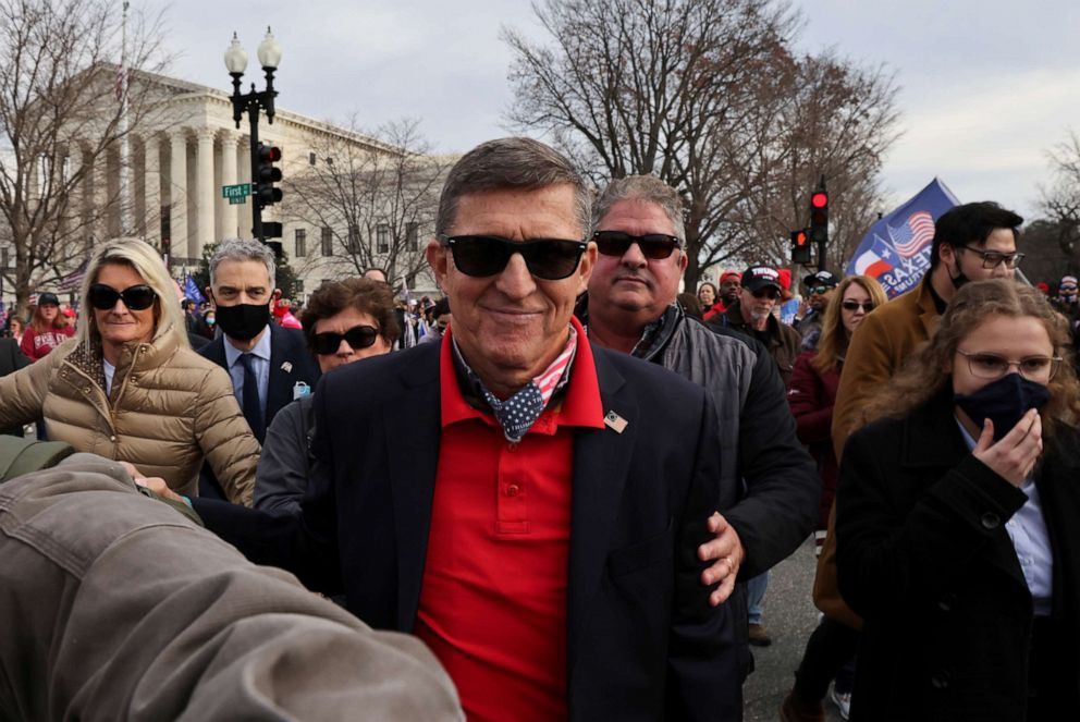 PHOTO: Former U.S. national security adviser Michael Flynn looks on as supporters of President Donald Trump rally to protest the results of the election in front of Supreme Court building, in Washington, D.C., Dec. 12, 2020.