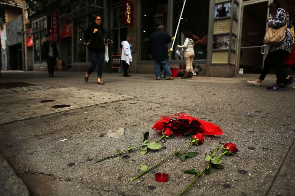 PHOTO: Roses are left next to where the body of Michael Jones, a youth soccer coach for the New York Red Bulls, was found early Sunday morning outside a Levi's store, Oct. 8, 2012, in New York City.