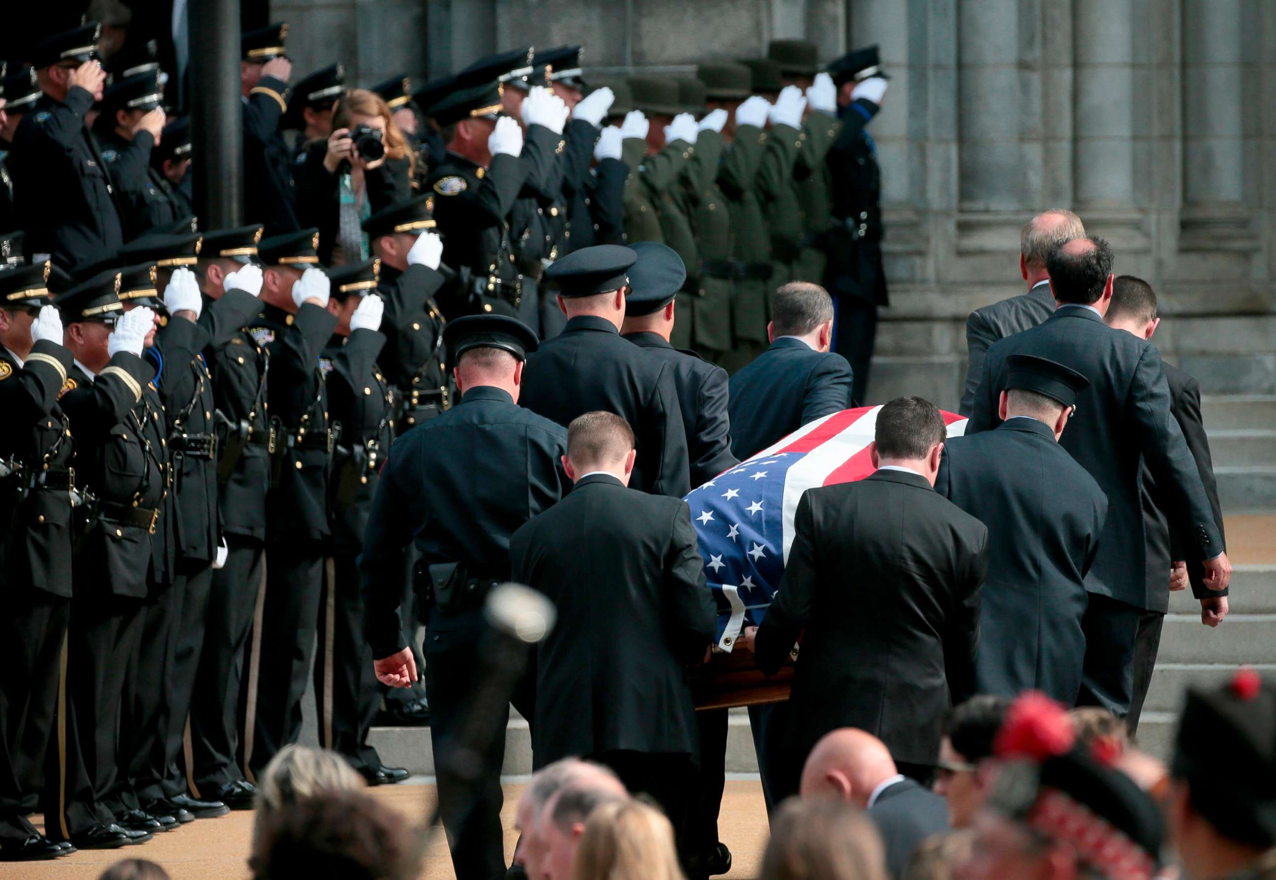 PHOTO: Pallbearers carry the casket of North County Cooperative Officer Michael Langsdorf inside the Cathedral Basilica of St. Louis for his funeral Mass on July 1, 2019.