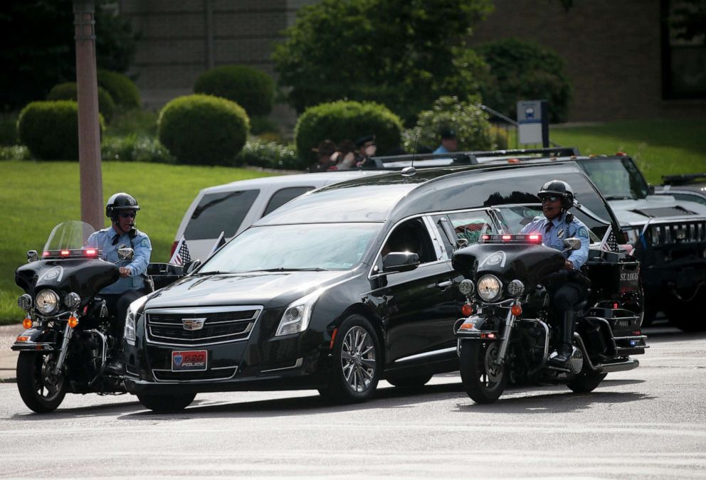 PHOTO: A motorcycle unit escorts the hearse carrying the casket of North County Cooperative Police Officer Michael Langsdorf to his funeral mass at the Cathedral Basilica of St. Louis on July 1, 2019, in St. Louis.