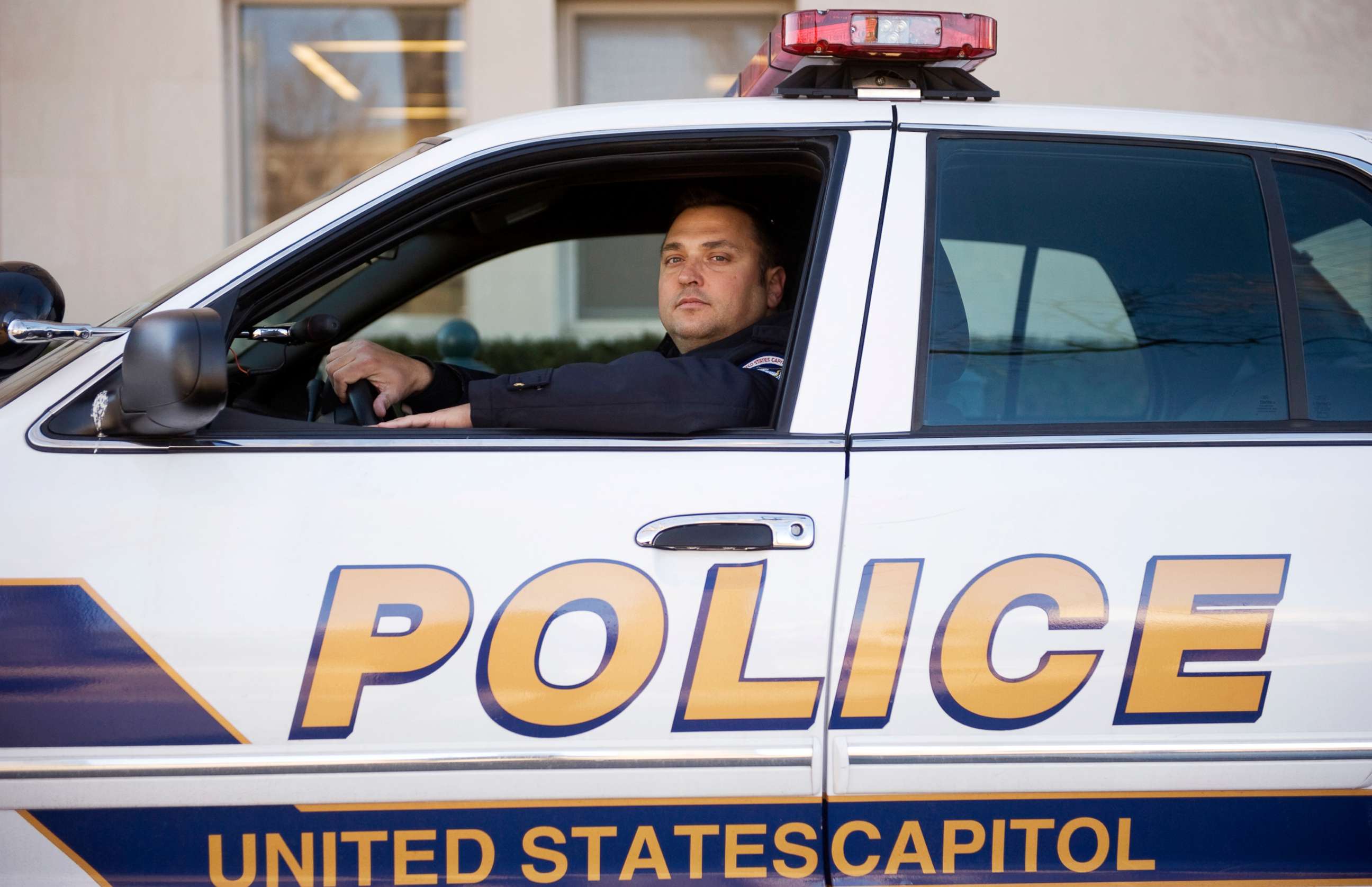 PHOTO: U.S. Capitol Police Officer Michael Riley poses for a picture outside of headquarters in Washington, Feb. 15, 2011.