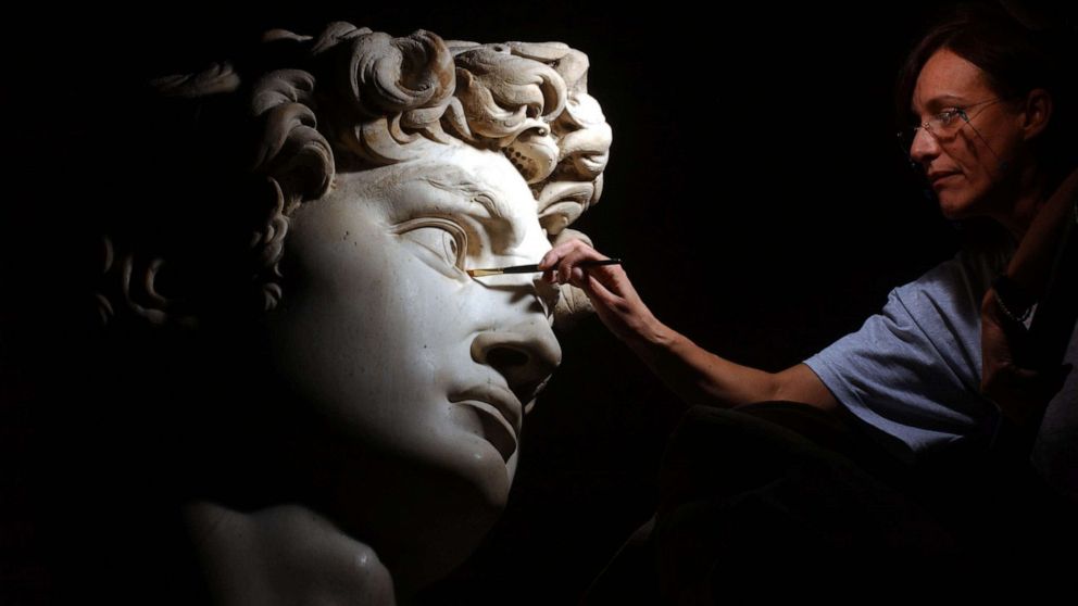 PHOTO: FILE - Restorer Cinzia Parnigoni cleans Michelangelo's masterpiece "David" during restoration work at the Galleria dell Accademia, Oct. 6, 2003 in Florence, Italy.