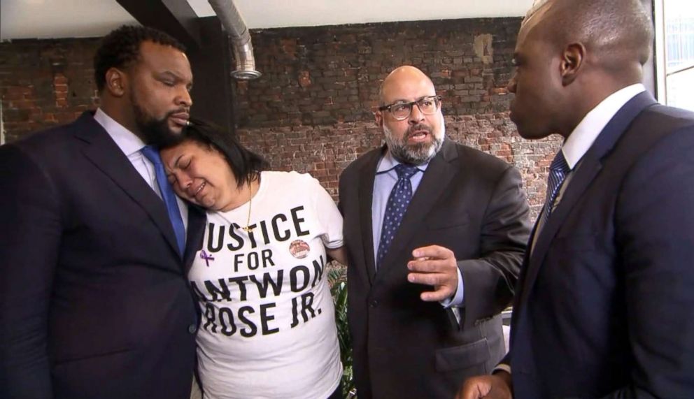PHOTO: Antwon Rose's mother, Michelle Kenney, leans on attorney Lee Merritt for support while attorney Fred Rabner talks with ABC News in Pittsburgh, June 27, 2018.