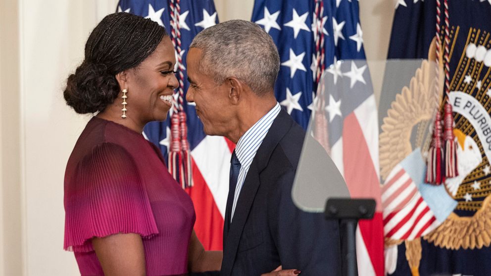 PHOTO: Former First Lady Michelle Obama and former U.S. President Barack Obama embrace at a ceremony to unveil their official White House portraits at the White House on Sept. 7, 2022.
