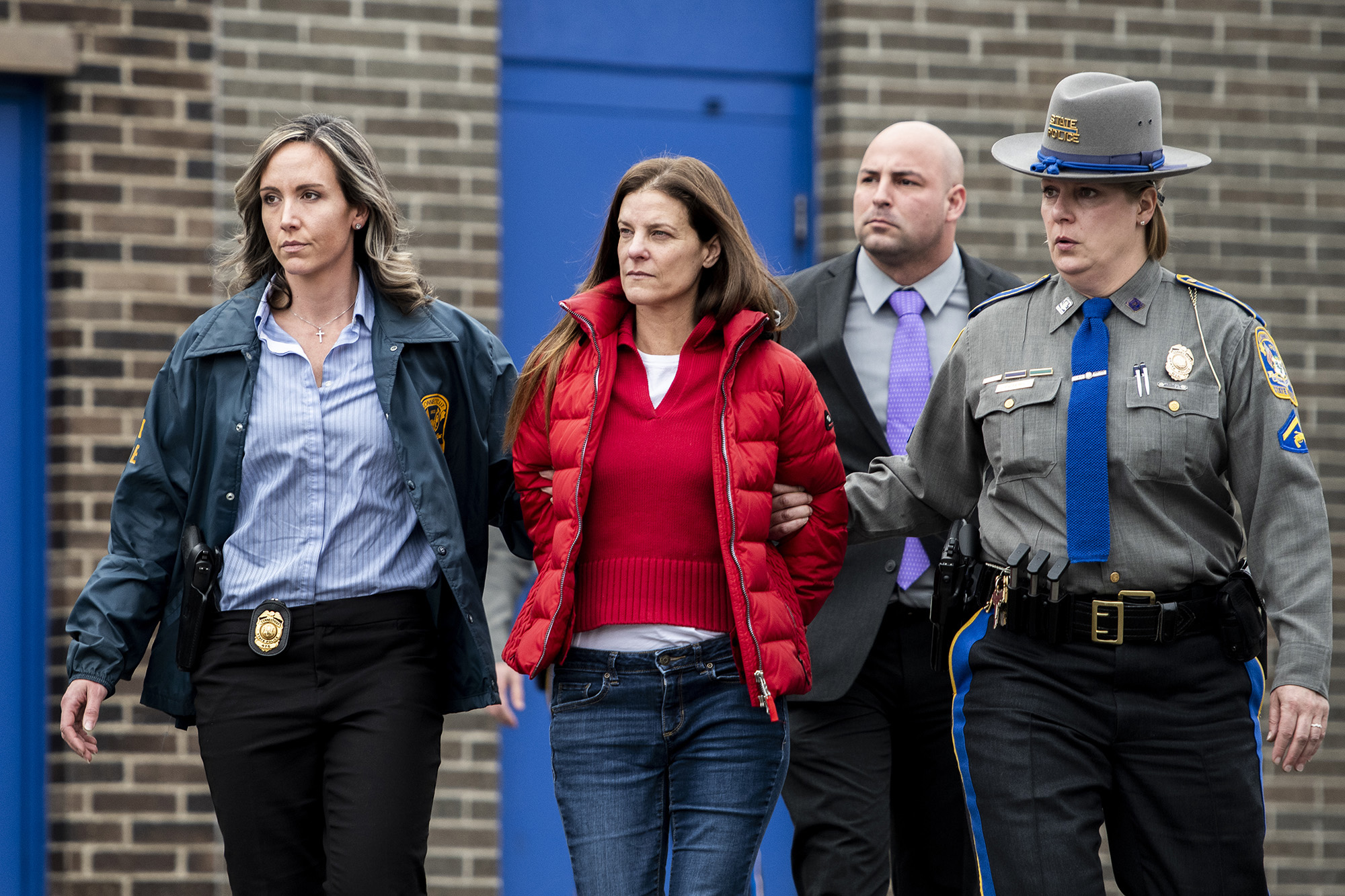 PHOTO: Michelle Troconis is escorted out of the Troop G State Police station before being placed into a cruiser, Jan. 7, 2020.