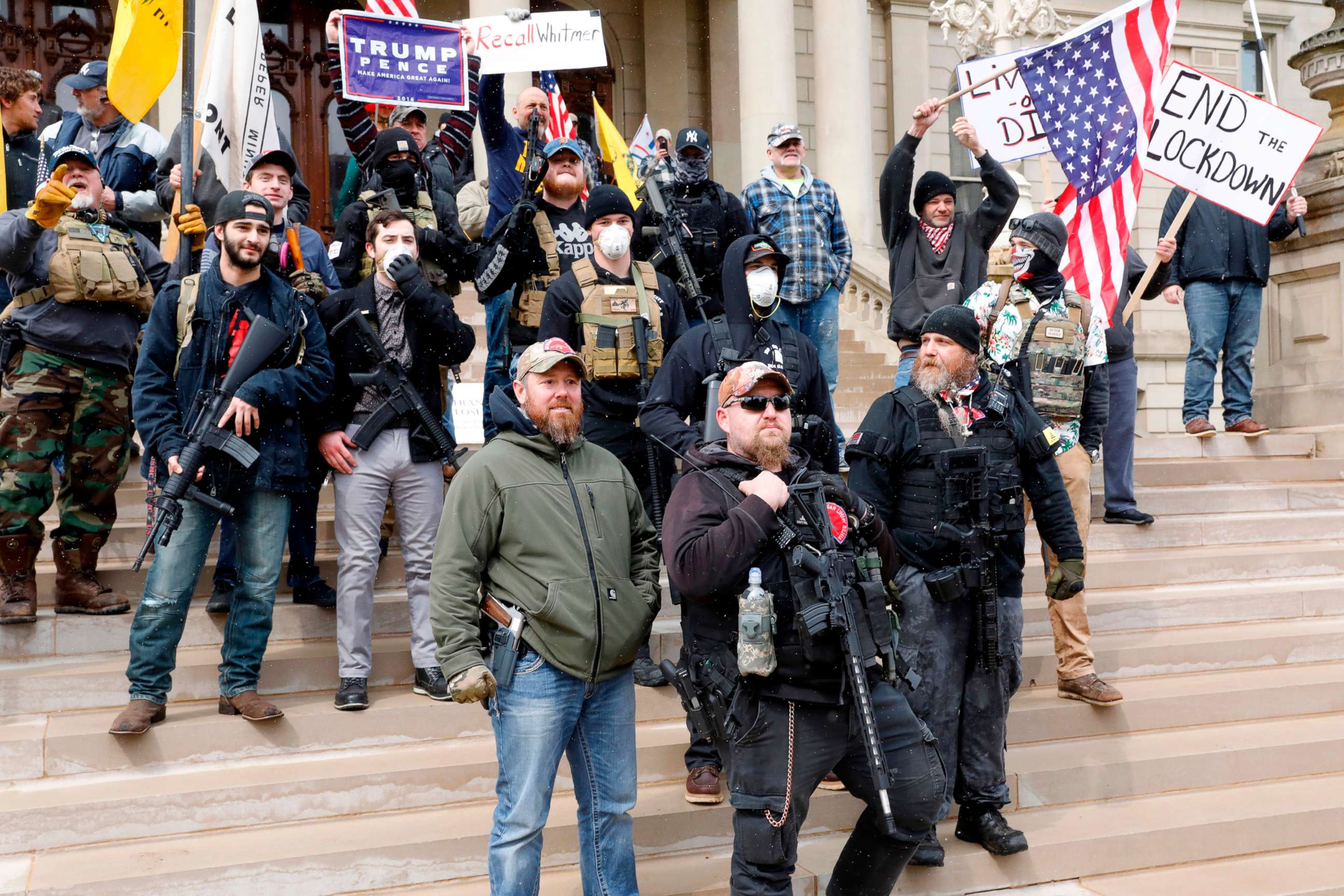 PHOTO: People take part in a protest for "Michiganders Against Excessive Quarantine" at the Michigan State Capitol in Lansing, Mich., April 15, 2020. 