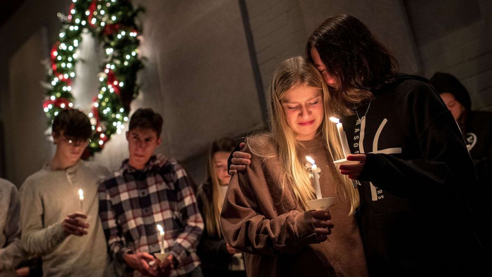 PHOTO: Members of the community attend a prayer service and candlelight vigil at Bridgewood Church in Clarkston, Mich., a day after a 15-year-old student killed four classmates, Dec. 1, 2021. 