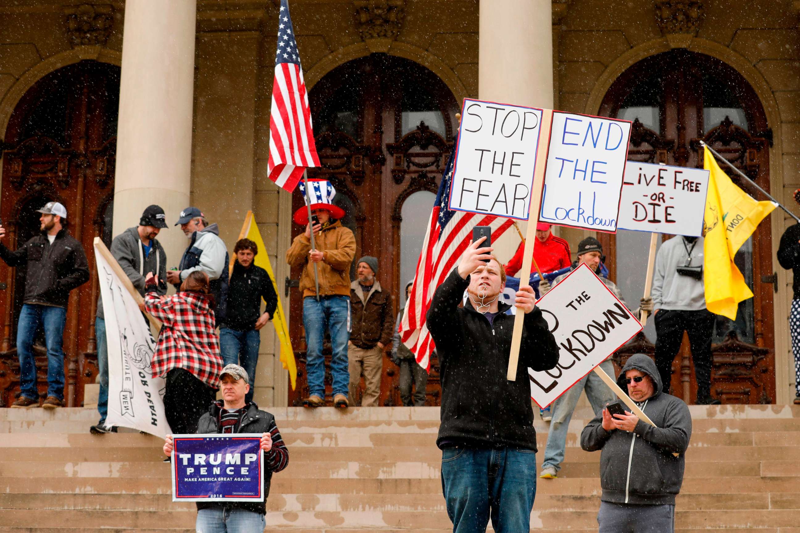 PHOTO: People protest against what they consider to be excessive quarantine amid the coronavirus pandemic at the Michigan State Capitol in Lansing, Mich., April 15, 2020.