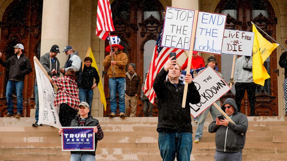 PHOTO: People protest against what they consider to be excessive quarantine amid the coronavirus pandemic at the Michigan State Capitol in Lansing, Mich., April 15, 2020.