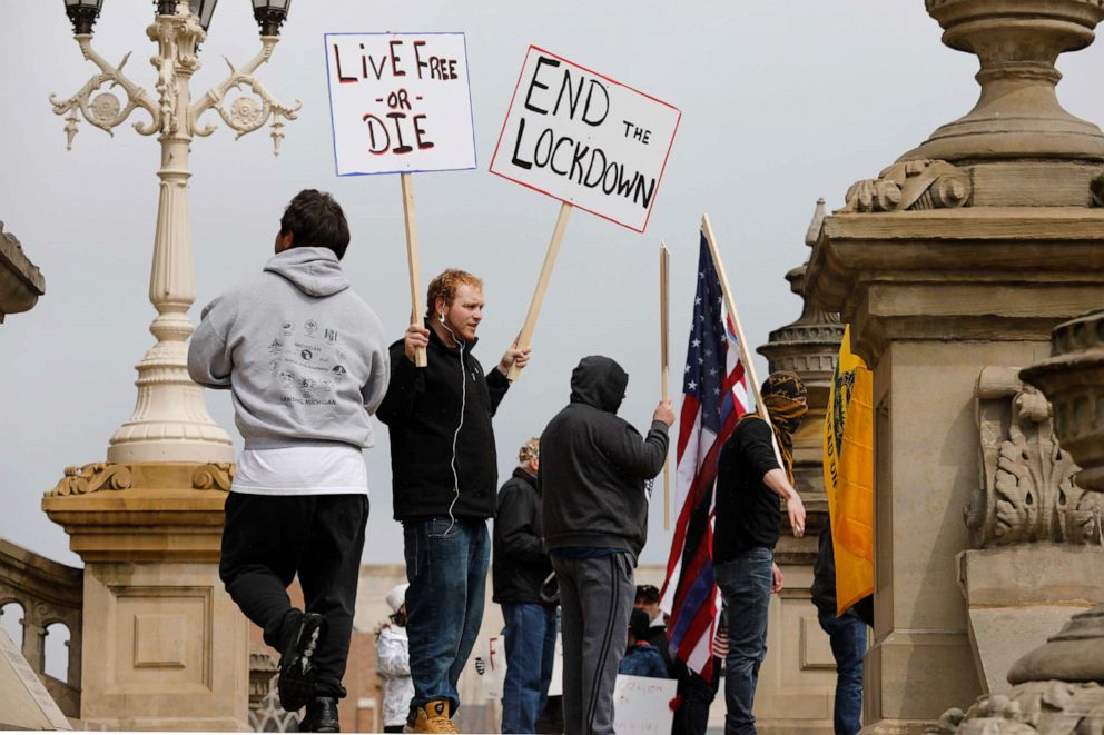 PHOTO: People protest against what they call excessive quarantine at the Michigan State Capitol in Lansing, Mich., April 15, 2020.