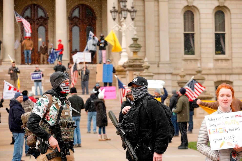 PHOTO: A protest organized by "Michiganders Against Excessive Quarantine" gathers around the Michigan State Capitol in Lansing, Mich., April 15, 2020.
