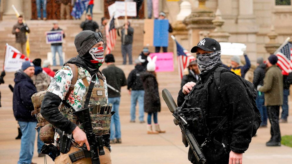 PHOTO: A protest organized by "Michiganders Against Excessive Quarantine" gathers around the Michigan State Capitol in Lansing, Mich., April 15, 2020.