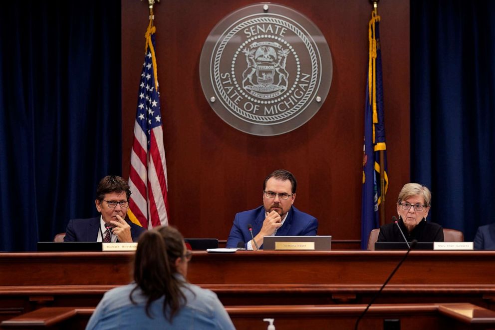 PHOTO: Richard Houskamp, left, Anthony Daunt and Mary Ellen Gurewitz, members of the Michigan state Board of Canvassers listen to a speaker during a hearing in Lansing, Mich., Aug. 31, 2022.