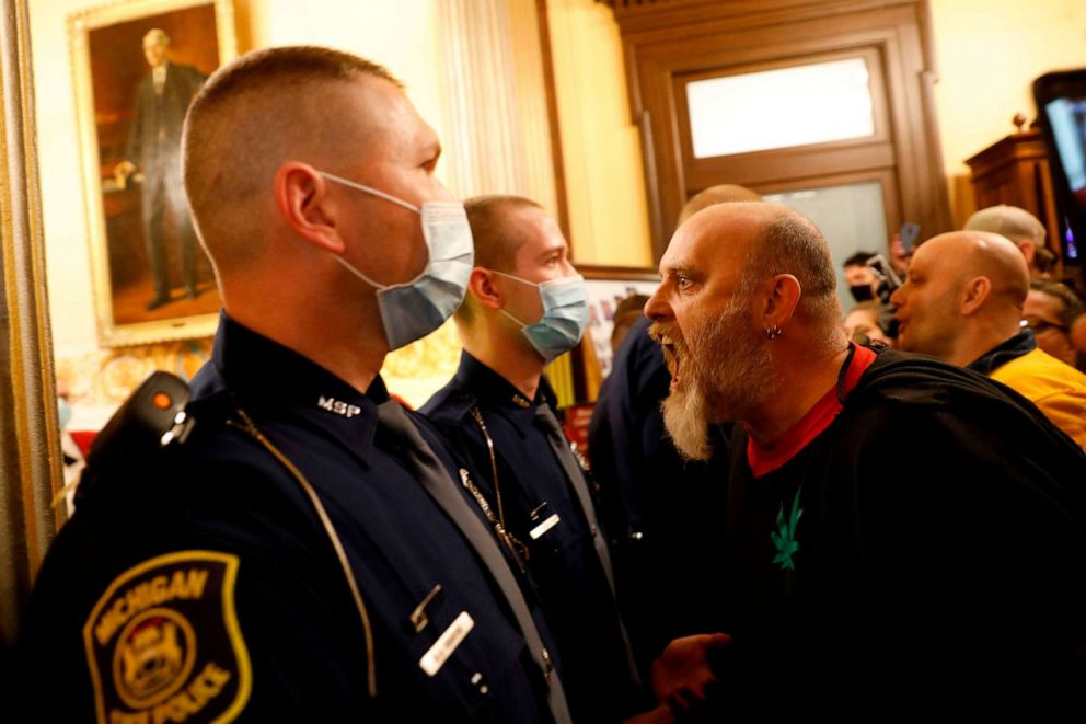 PHOTO: Protesters try to enter the Michigan House of Representative chamber in Lansing, Mich., April 30, 2020.