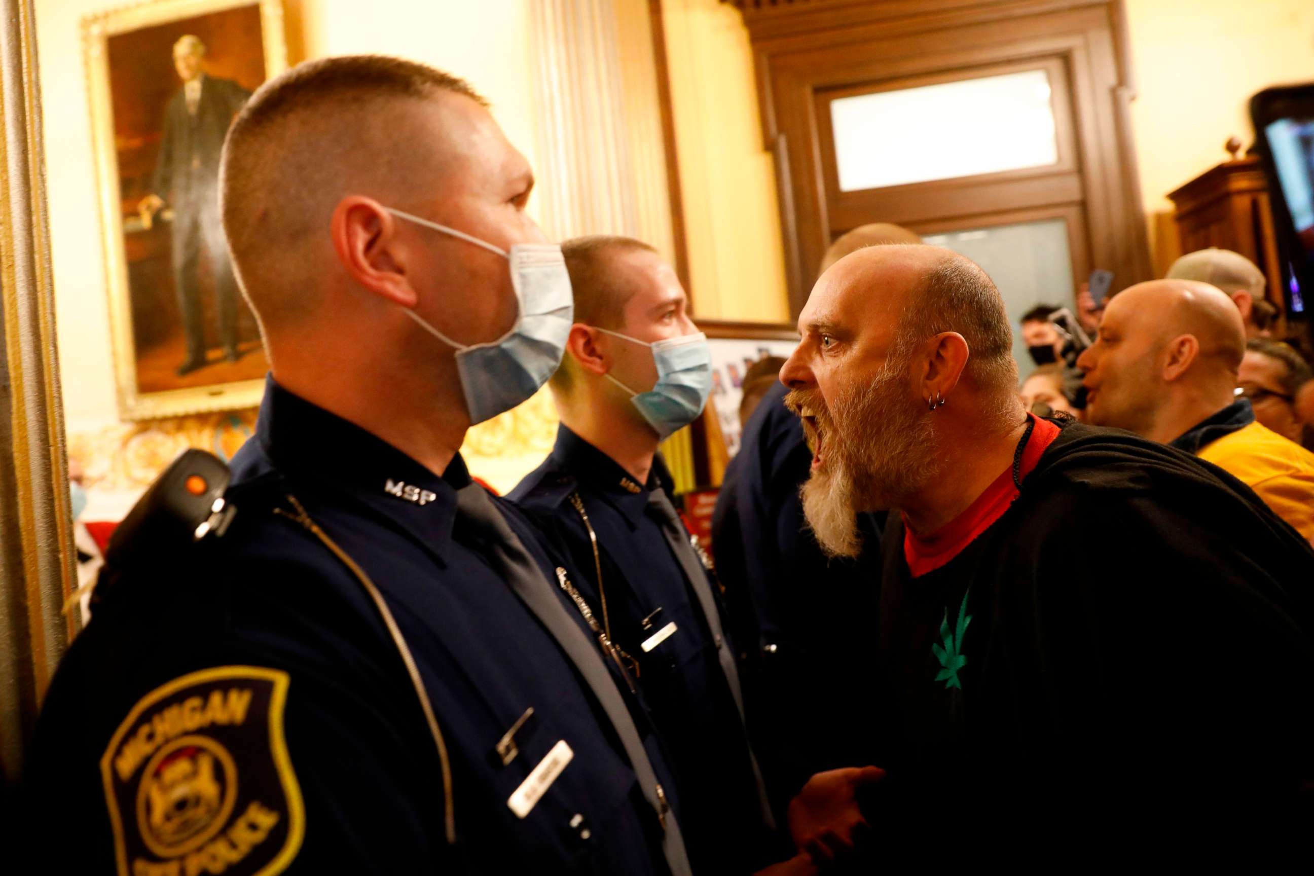 PHOTO: Protesters try to enter the Michigan House of Representative chamber after the American Patriot Rally for the reopening of businesses on the steps of the Michigan State Capitol in Lansing, Mich., April 30, 2020.