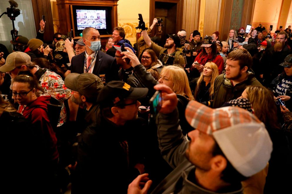 PHOTO: Protesters try to enter the Michigan House of Representative chamber after the American Patriot Rally for the reopening of businesses on the steps of the Michigan State Capitol in Lansing, Mich., April 30, 2020.