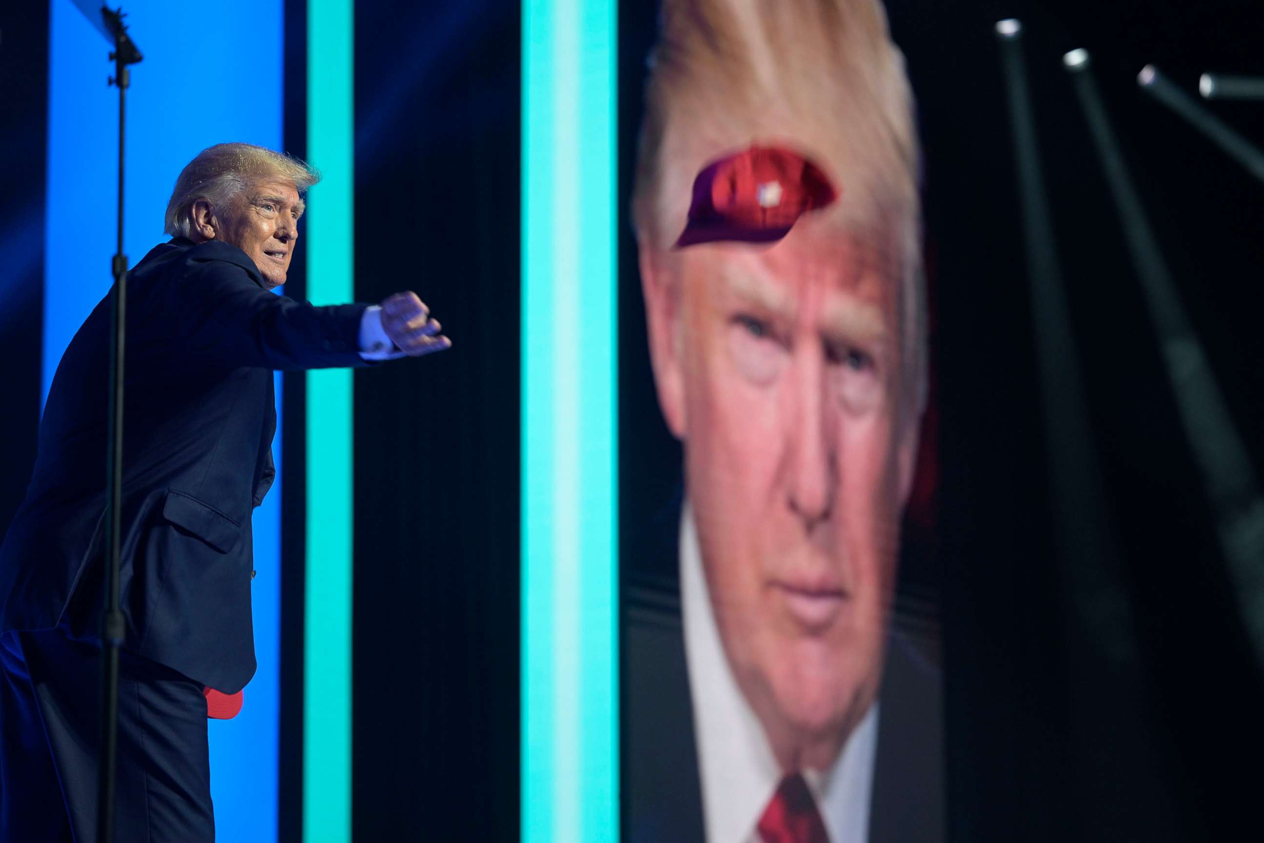 PHOTO: Former President Donald Trump tosses hats into the crowd before addressing attendees during the Turning Point USA Student Action Summit in Tampa, Fla., July 23, 2022.