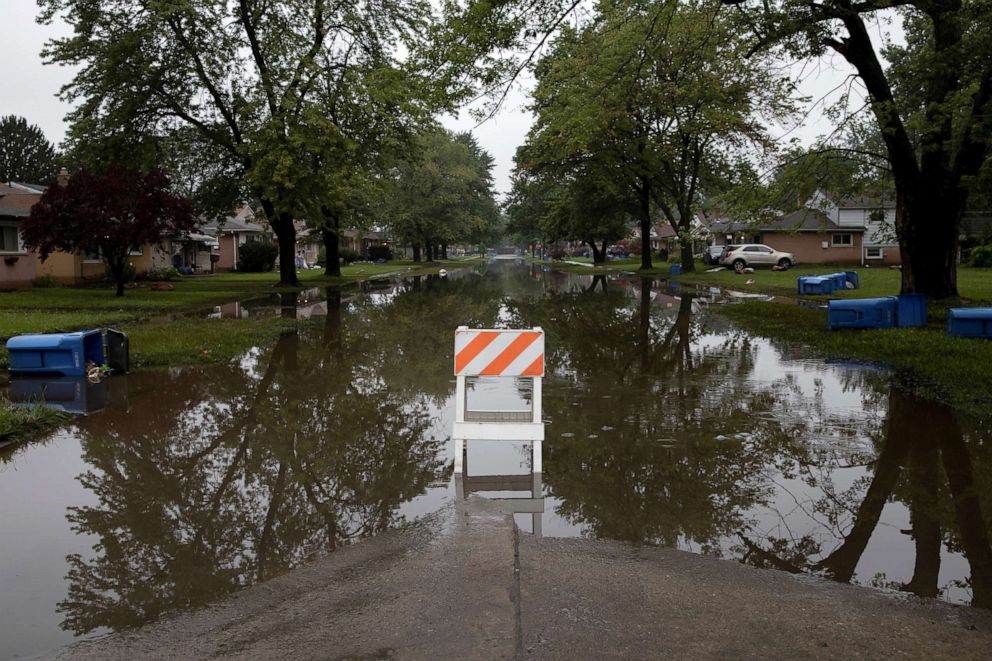 PHOTO: A road marker is seen blocking off Hanover Street which flooded as a result of heavy rain in Dearborn Heights, Michigan, July 17, 2021.