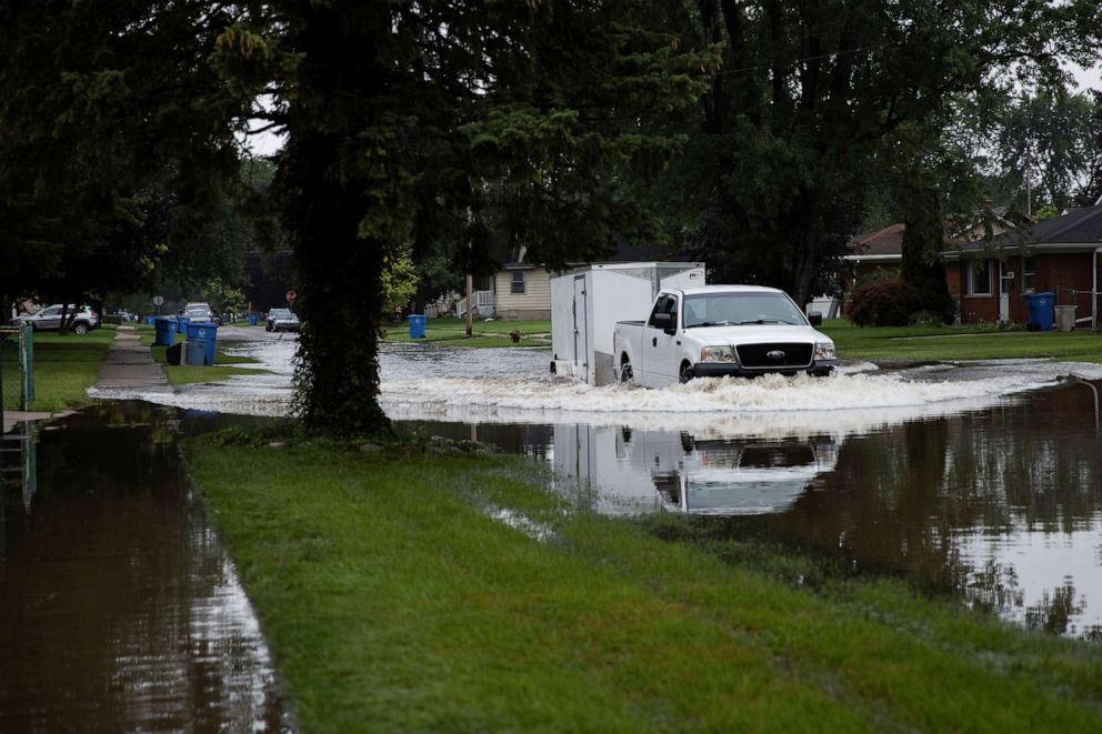 PHOTO: A truck makes its way through Edgewood Street which flooded as a result of heavy rain in Dearborn Heights, Michigan, July 17, 2021.