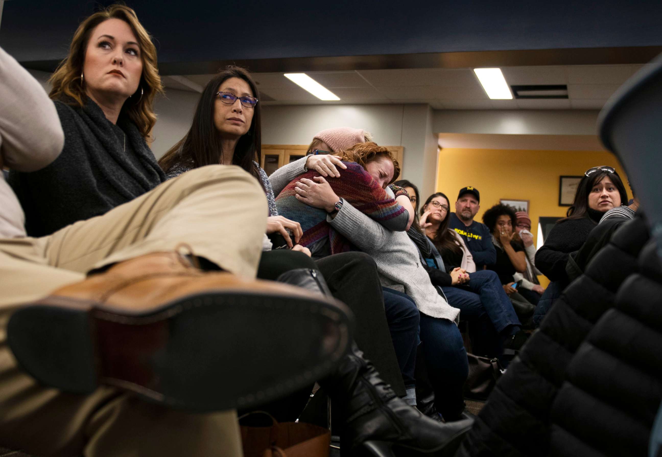 PHOTO: Lisa Householder is embraced after giving an emotional speech during a school diversity and inclusion meeting community meeting at Liberty School in Saline, Mich., Monday, Feb. 3, 2020.