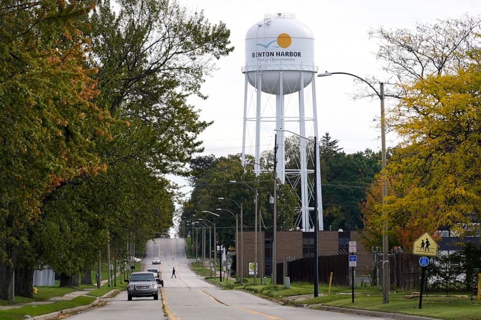 PHOTO: A resident walks across Britain Street near the city's water tower in Benton Harbor, Mich., Oct. 22, 2021.