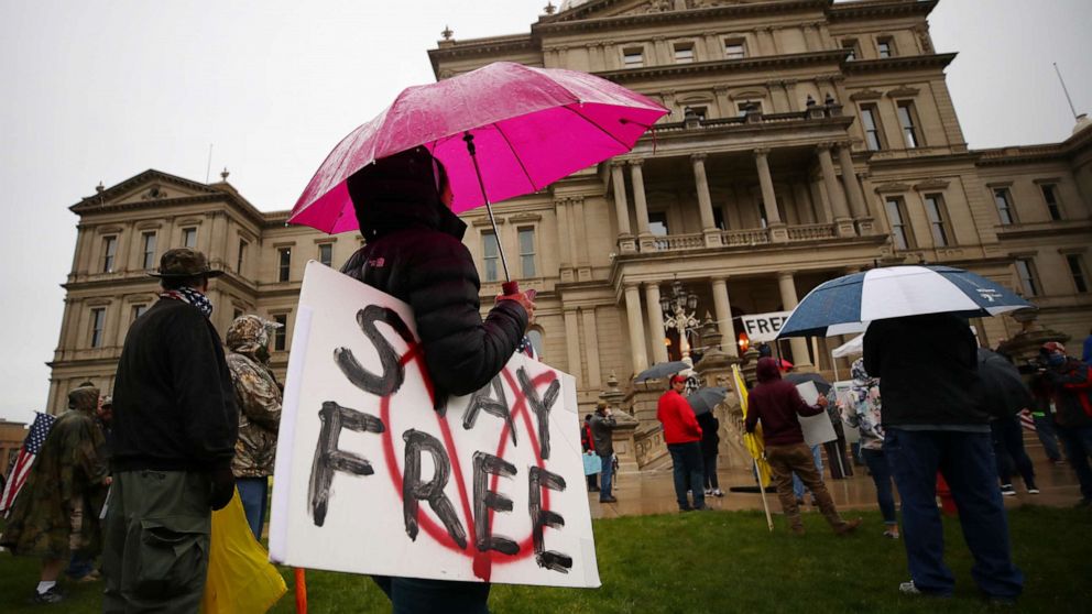 PHOTO: Protesters angry at Michigan Governor Gretchen Whitmer gather at the Michigan Capitol Building on May 14, 2020 in Lansing, Mich.