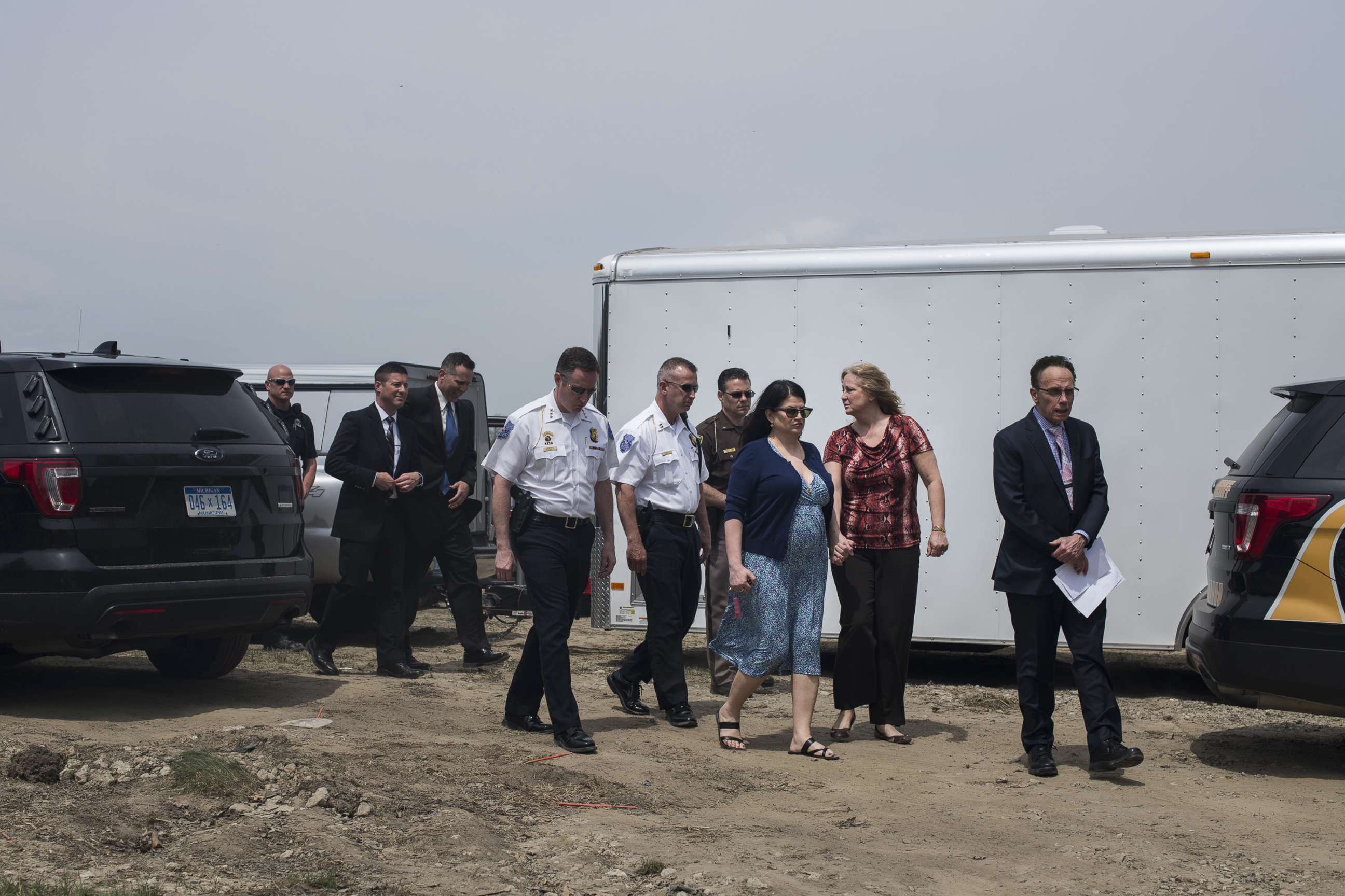 PHOTO: Members of the Warren Police Department escort Connie Beyma, right, and Annie Godbout, left, at the start of a press conference on May 9, 2018 in Macomb, Mich.