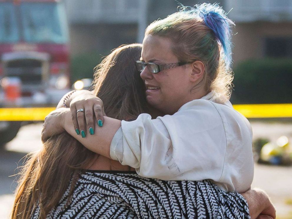 PHOTO: Hotel residents Cassundra Clements, left, and Sarah Sanders comfort one another after a fire at the Cosmo Extended Stay Motel in Sodus Township, Mich., July 28, 2018.