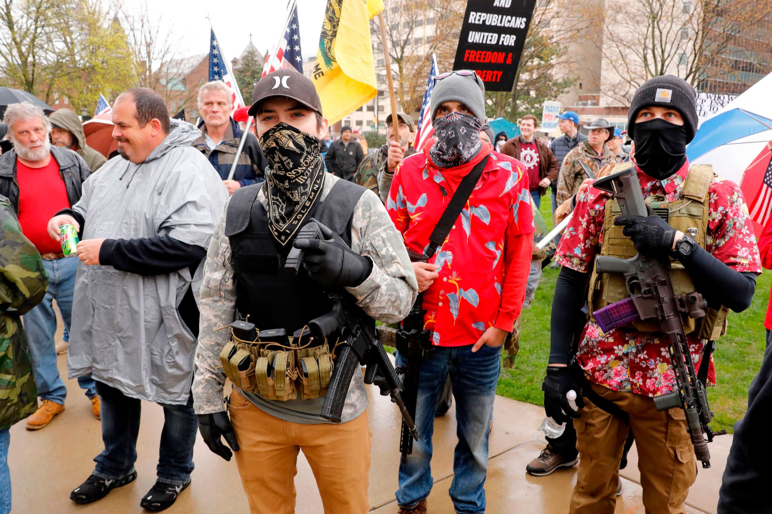 PHOTO: Armed protesters take part in an "American Patriot Rally," April 30, 2020, on the steps of the Michigan State Capitol in Lansing, Mich.