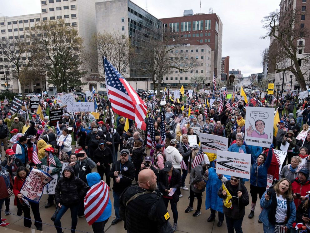 PHOTO: Protesters rally outside of the state capitol building before the vote on the extension of Governor Gretchen Whitmer's emergency declaration/stay-at-home order due to the coronavirus disease (COVID-19) outbreak, in Lansing, Mich., April 30, 2020.