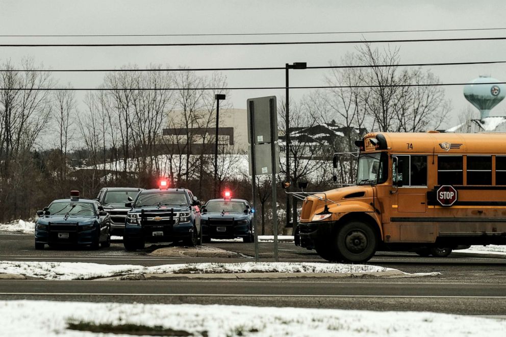 PHOTO: In this Nov. 30, 2021, file photo, police cars restrict access to Oxford High School following a shooting, in Oxford, Mich.
