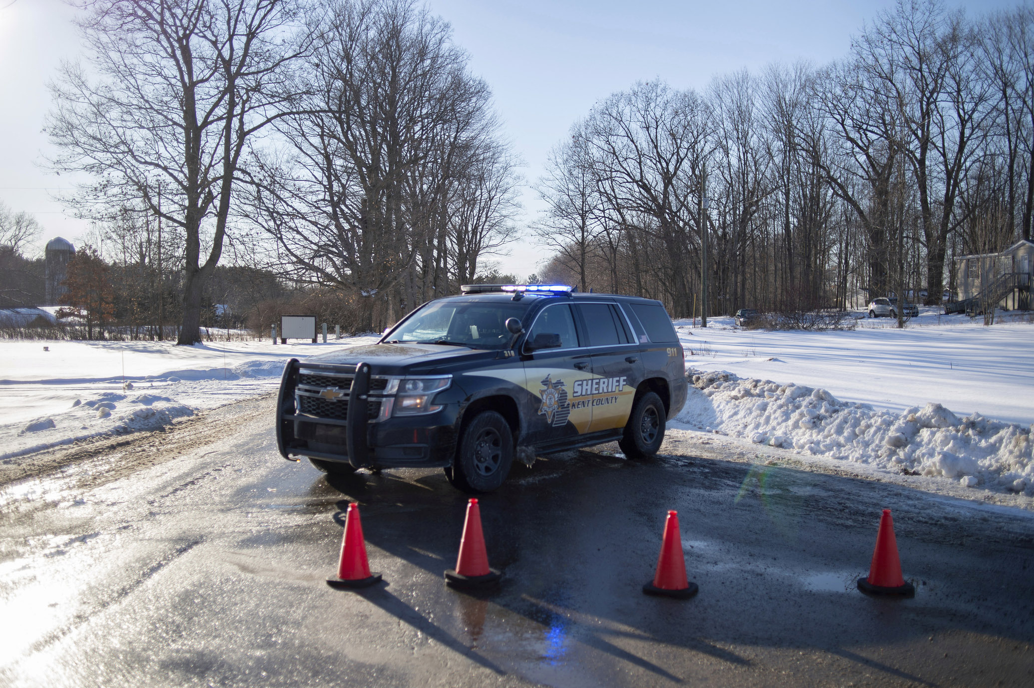 PHOTO: Kent County Sheriff personnel investigate the scene of a fatal shooting near the corner of 19 Mile NE and Division Avenue NE at a property on Monday, Feb. 18, 2019, near Cedar Springs, Mich.