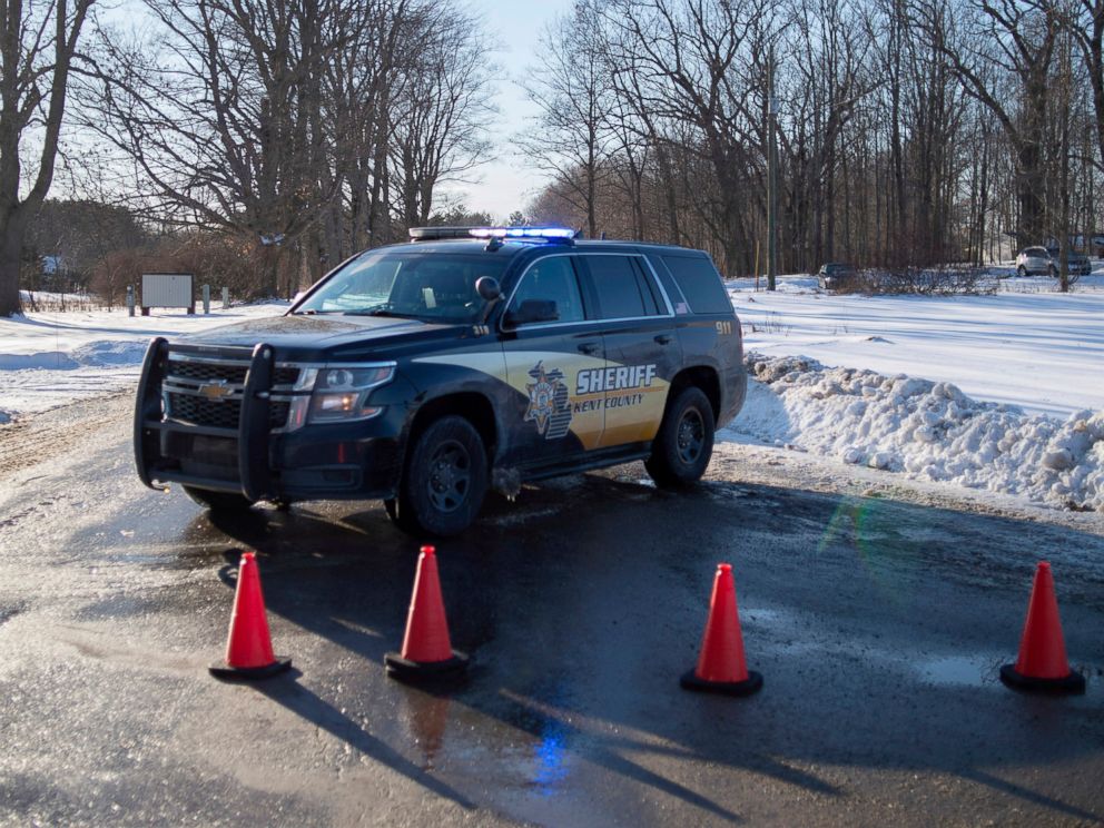 PHOTO: Kent County Sheriff personnel investigate the scene of a fatal shooting near the corner of 19 Mile NE and Division Avenue NE at a property on Monday, Feb. 18, 2019, near Cedar Springs, Mich.