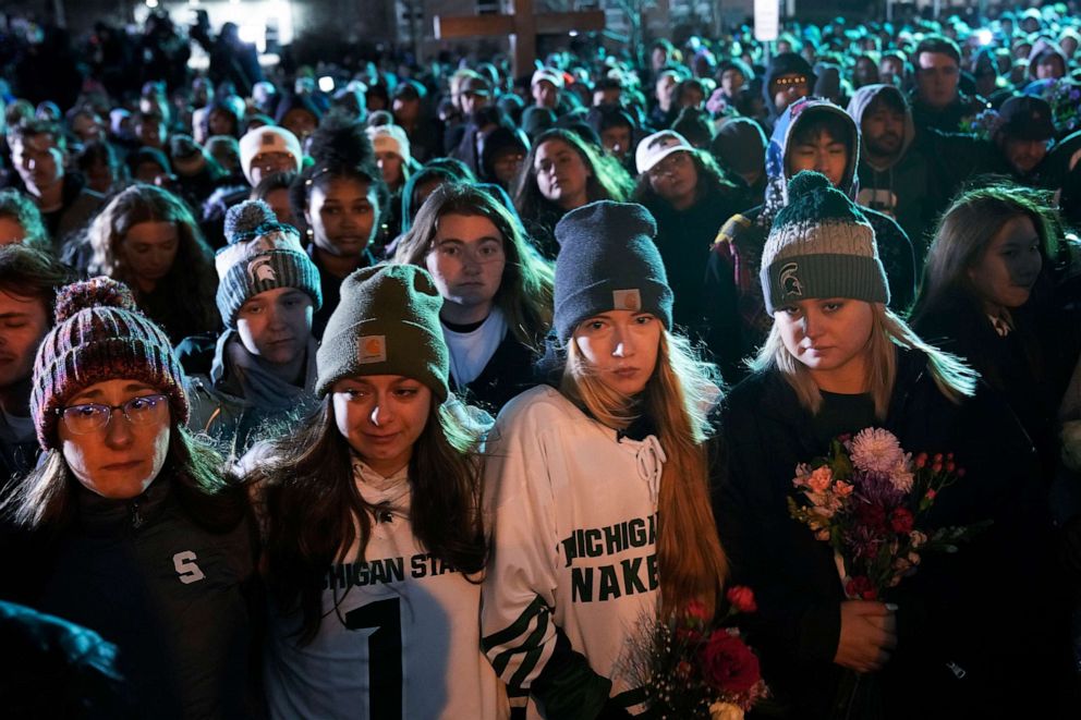 PHOTO: Mourners attend a vigil at The Rock on the grounds of Michigan State University in East Lansing, Mich., on Feb. 15, 2023.