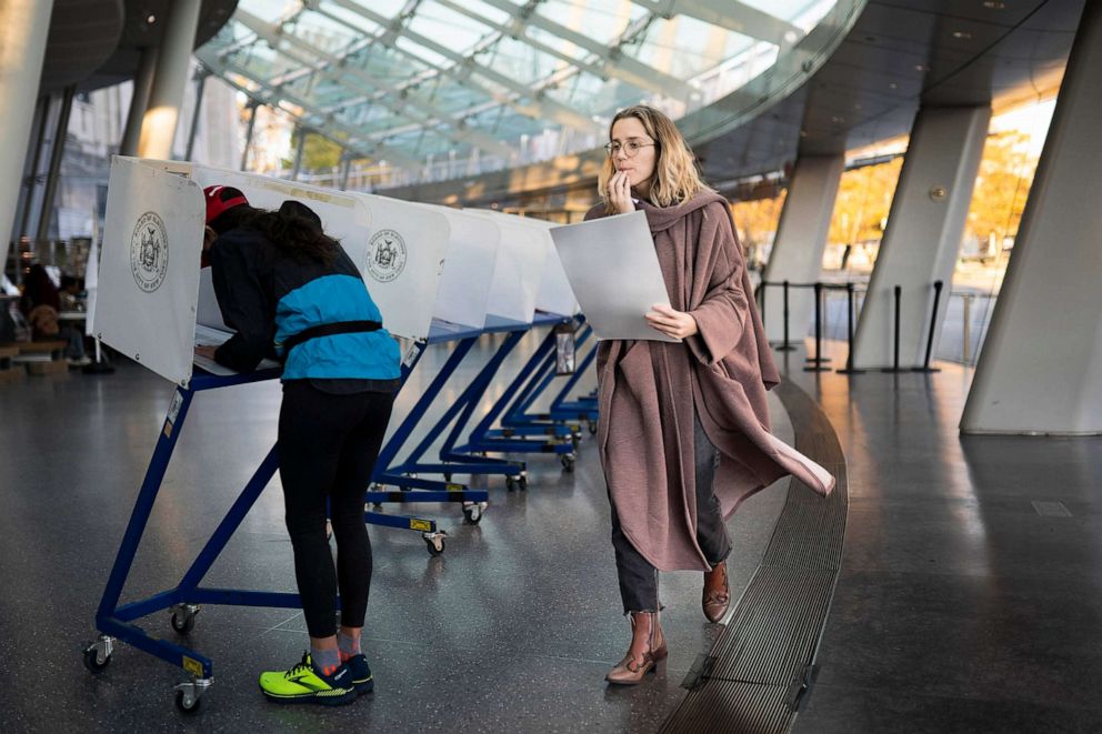 PHOTO: FILE - A voter moves to cast her ballot at an electronic counting machine at a polling site in the Brooklyn Museum, Nov. 8, 2022, in the Brooklyn borough of New York.