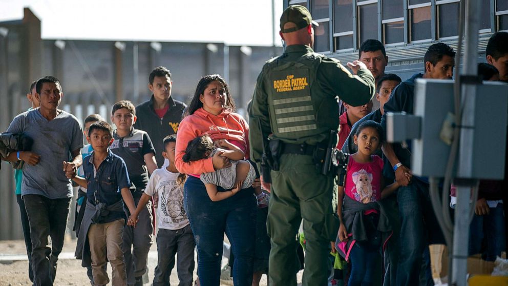 PHOTO: Migrants are loaded onto a bus by U.S. Border Patrol agents after being detained when they crossed into the United States from Mexico, June 1, 2019 in El Paso, Texas.